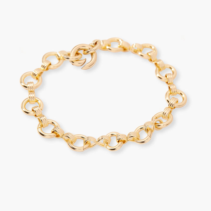 Merritt Bracelet with round textured links joined by ridged connectors, angled to show the lobster clasp closure.