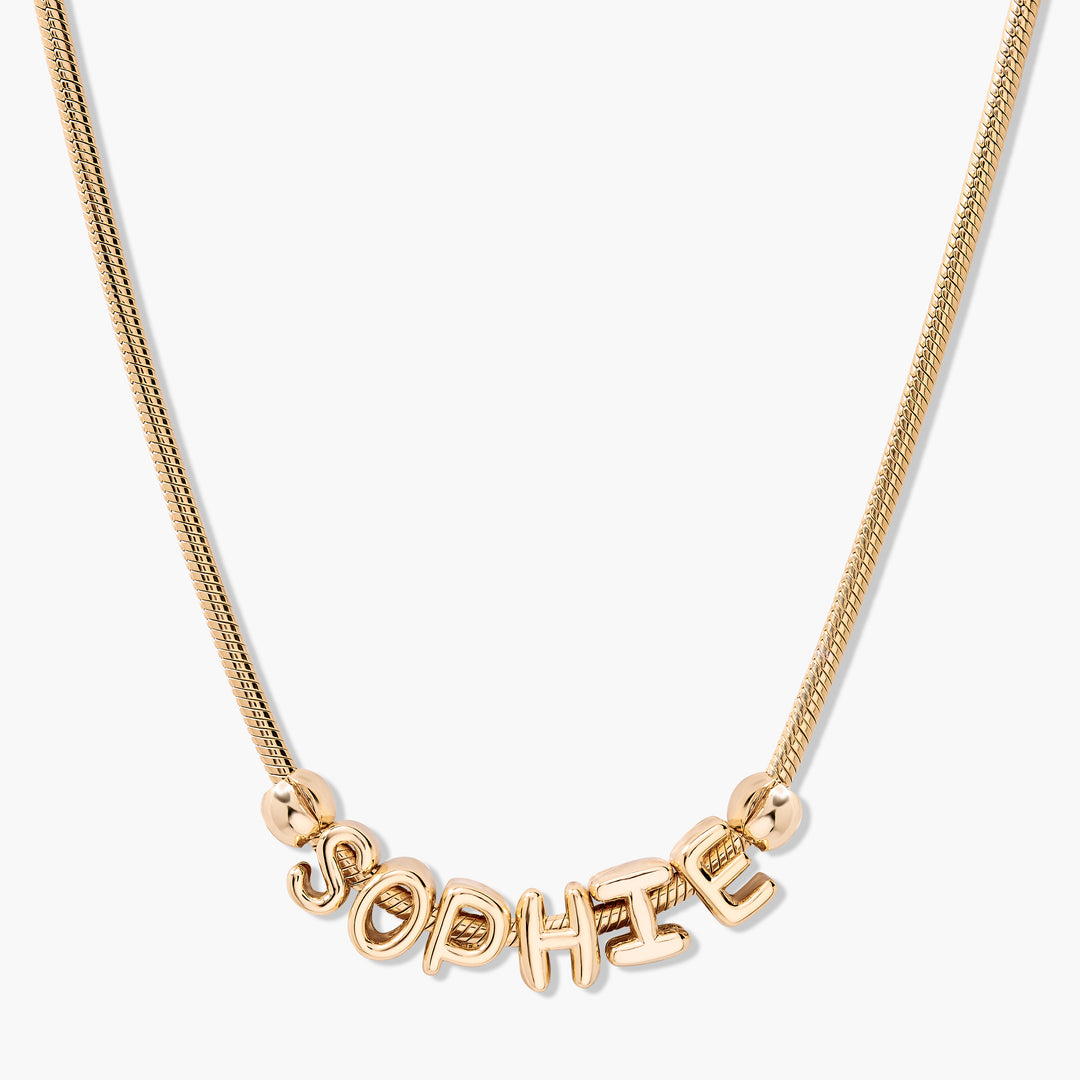 Gold-tone Breezy Name Chain Necklace with puffy balloon-style custom name letters sliding on a chain.