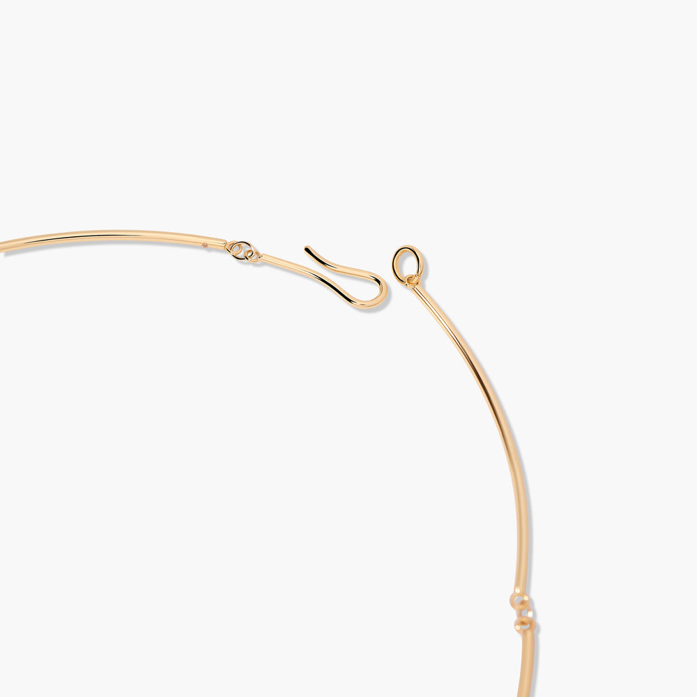  Close-up of the Sadie Wire Necklace hook clasp detail, a slim wire collar with small jump rings connecting segmented arcs.