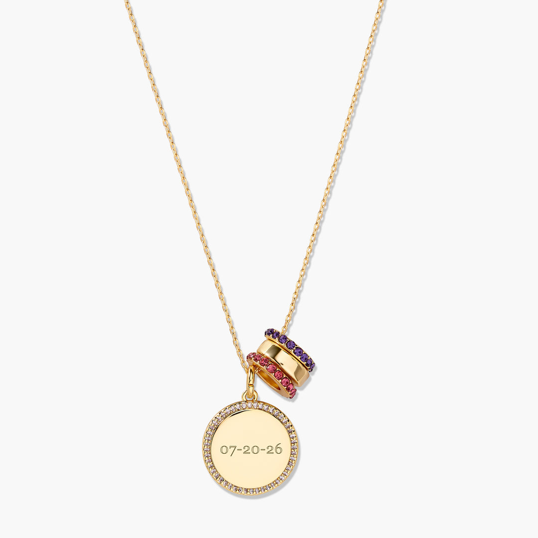 Gold-tone Anniversary Charm Necklace with a pavé-rimmed round disc pendant engraved with a custom date and two gemstone-set bead charms on a chain.