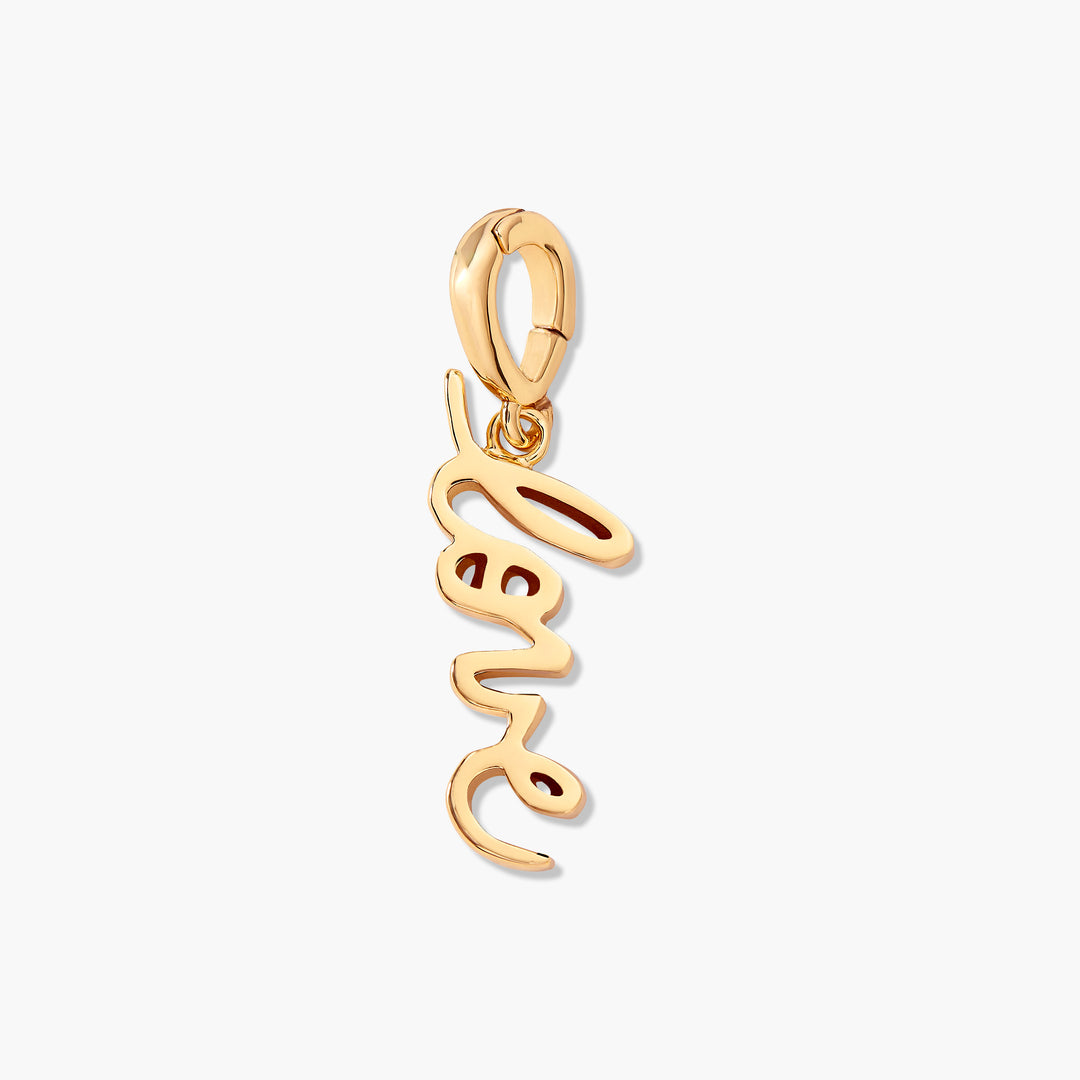 Gold-tone Effie Love Charm with a vertical cursive "love" script pendant hanging from a ring clasp.