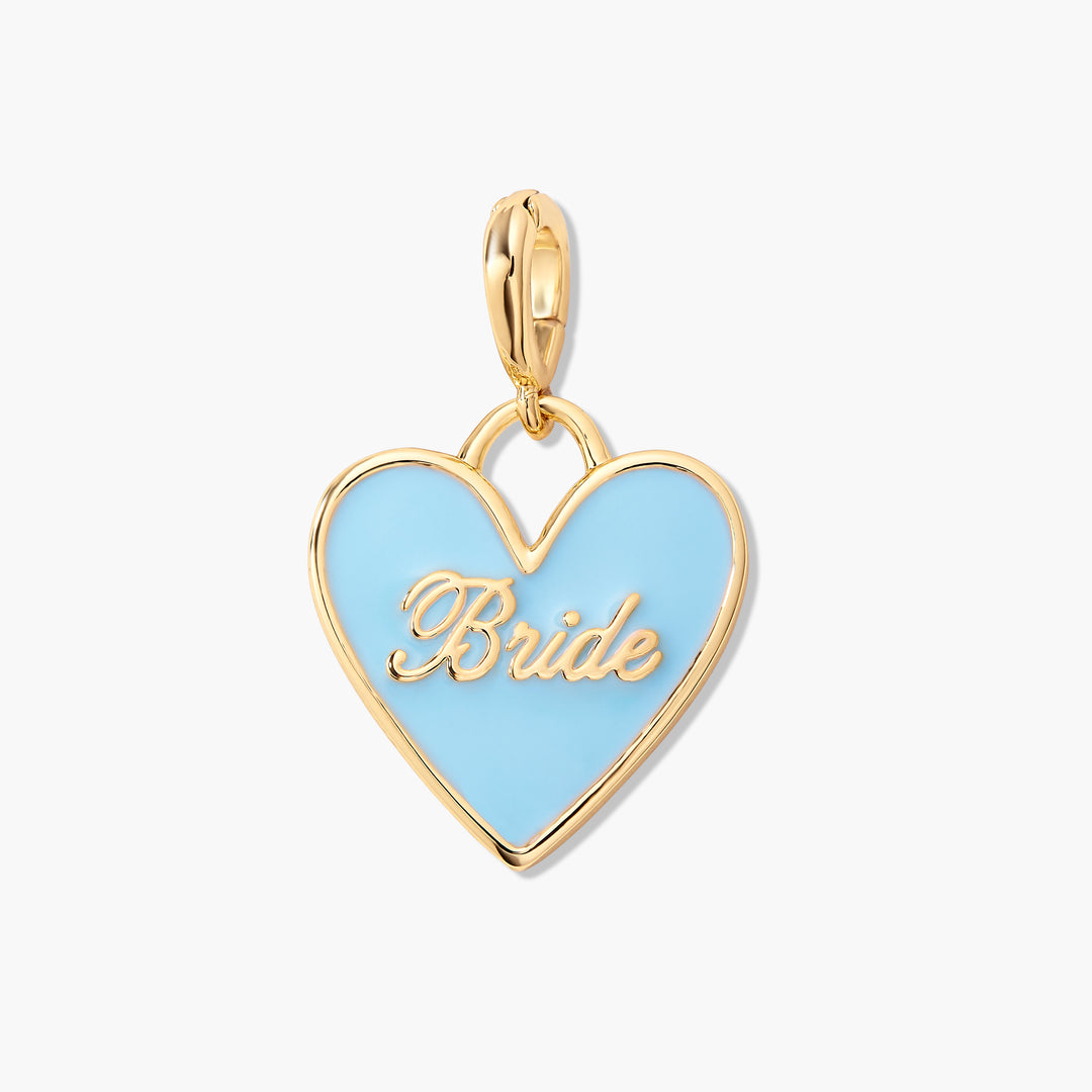 Gold-tone heart charm with light blue enamel and a raised script "Bride" inscription, attached to a ring clasp.