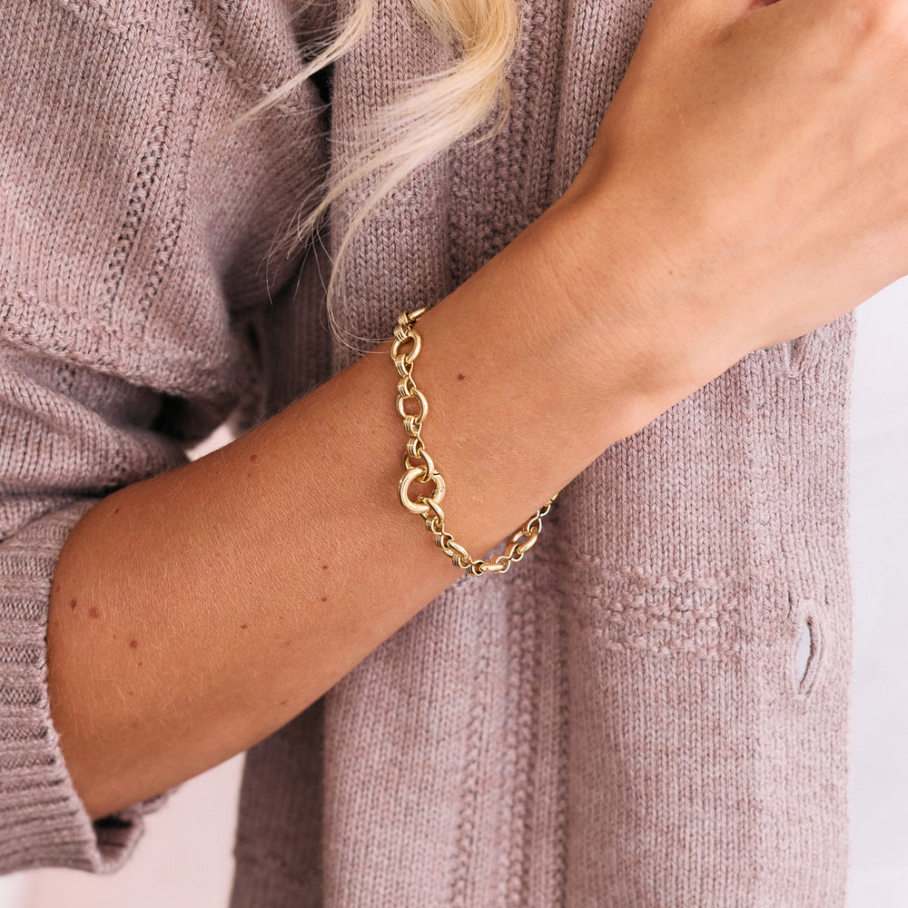  Merritt Bracelet with round textured links and a ring clasp, worn by a model.